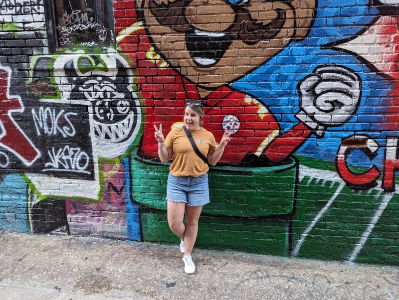 Posing in Front of Street Art